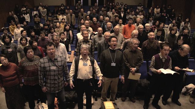 映画の一場面。市民合唱団の「歓喜の歌」の練習風景