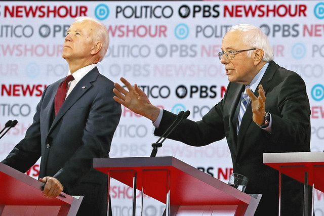 2019年12月、民主党の候補者争いの討論会で、左派上院議員サンダースの発言に天を仰ぐバイデン＝ゲッティ・共同