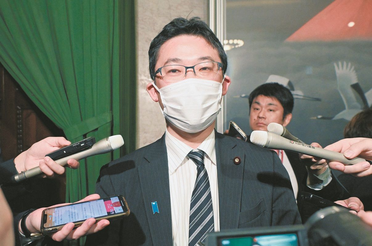 Takashi Fujiwara, a member of the House of Representatives, responds to a reporter's interview inside the Diet on March 12th.