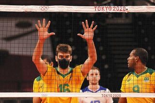 A Brazil's volleyball player wears face mask even during the matches
